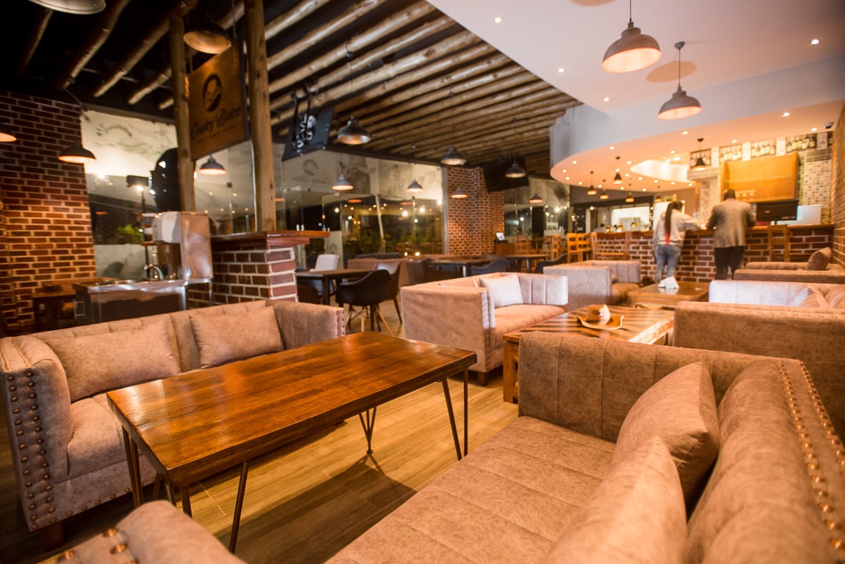 Comfortable seating area with wooden tables